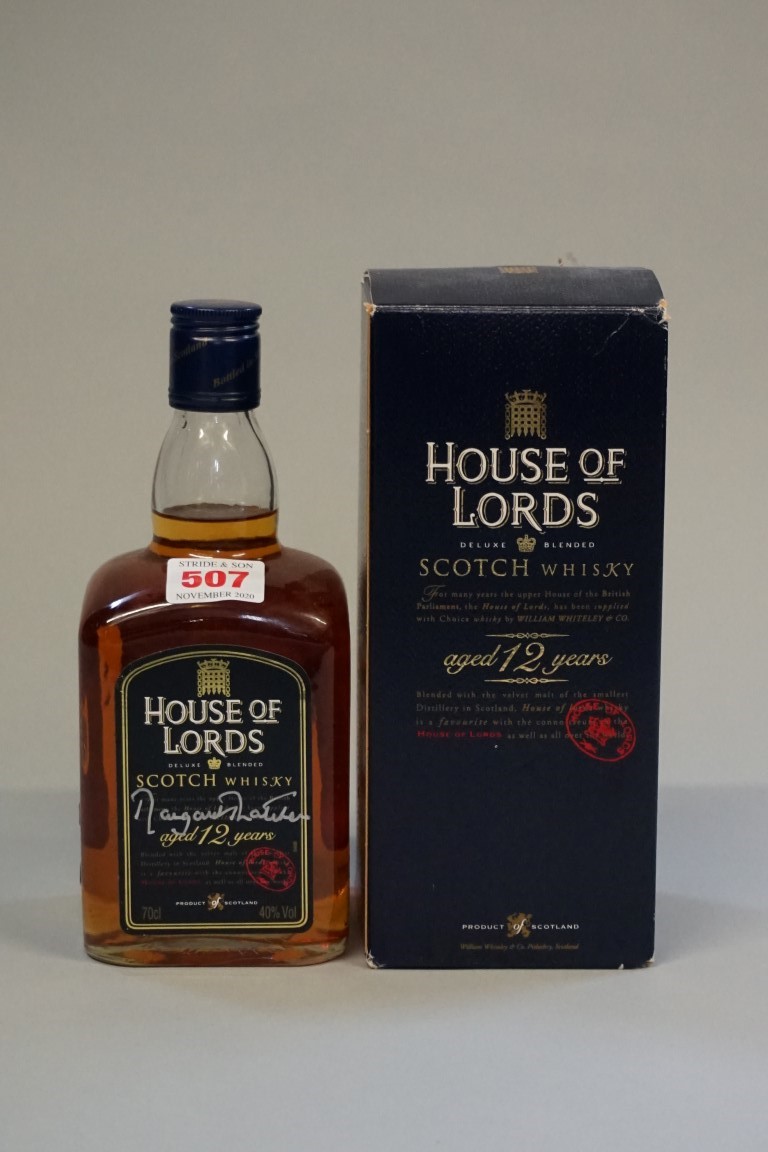 A 70cl bottle of House of Lords 12 year old blended whisky, autographed by Margaret Thatcher, in