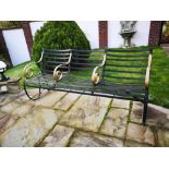 Garden seats: A wrought iron seat, circa 1900, 185cm wide Provenance: From a private garden in