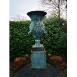 Garden urns/pots/planters: A patinated fibreglass urn on pedestal, the urn 150cm high