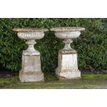 Garden urns/pots/planters: A pair of cast iron urns on pedestals, 2nd half 19th century, 110cm high