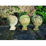 Finials: A set of three terracotta gate pier balls, 20th century, 45cm high Provenance: From a