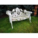 Garden seats: An oak and ivy pattern cast iron seat, possibly Coalbrookdale, early 20th century,
