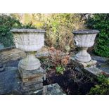 Garden urns/pots/planters: A pair of composition stone urns, 2nd half 20th century, 65cm high