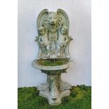 Fountains: A bronze wall fountain, last quarter 20th century , lion’s mouth and dolphins plumbed for