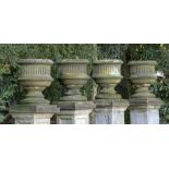 Garden urns/pots/planters: A set of four Victorian carved sandstone urns, circa 1860, 86cm high