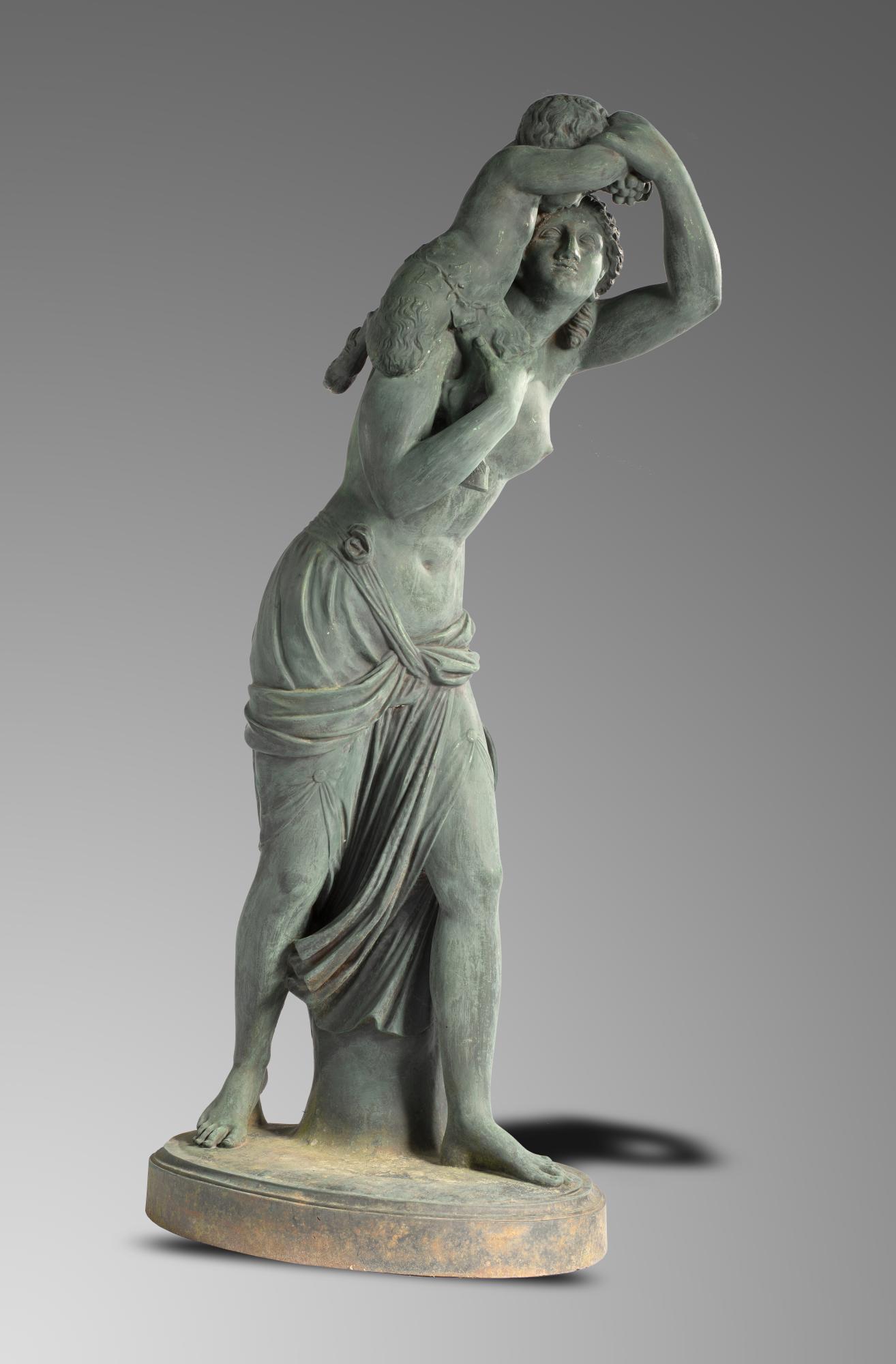 Garden statues/Sculpture: After Clodion: A cast iron figure of a Bacchante and young satyr by J J