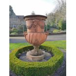 Garden urns/pots/planters: A substantial composition stone urn on plinth, 178cm high by 131cm wide