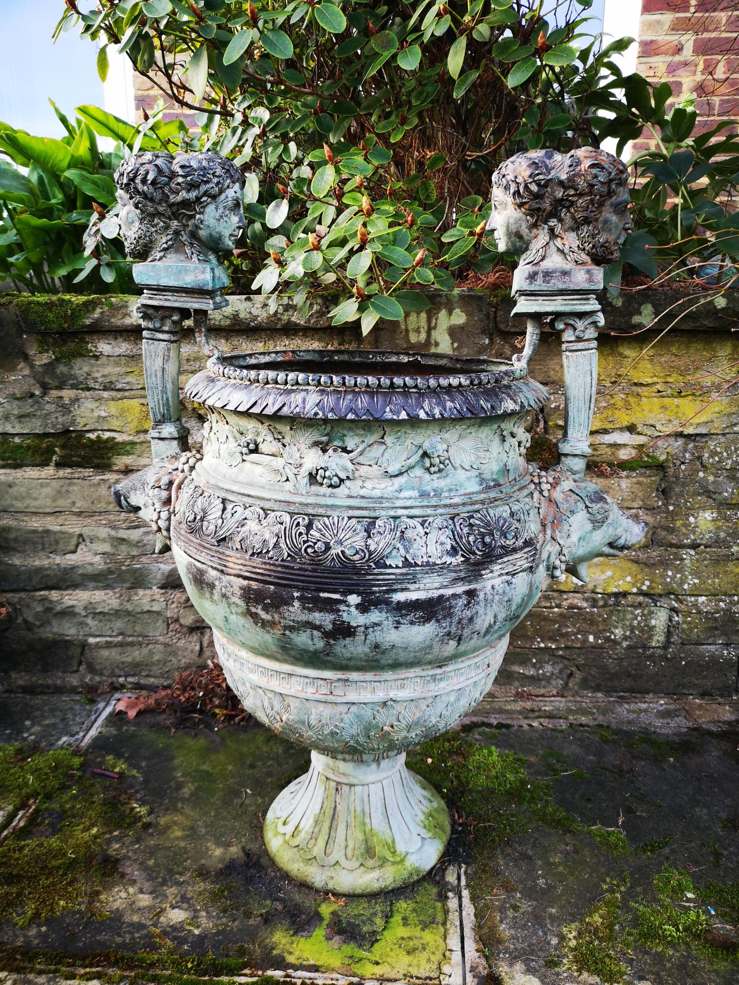 Garden urns/pots/planters: A similar pair of bronze urns Provenance: From a private garden