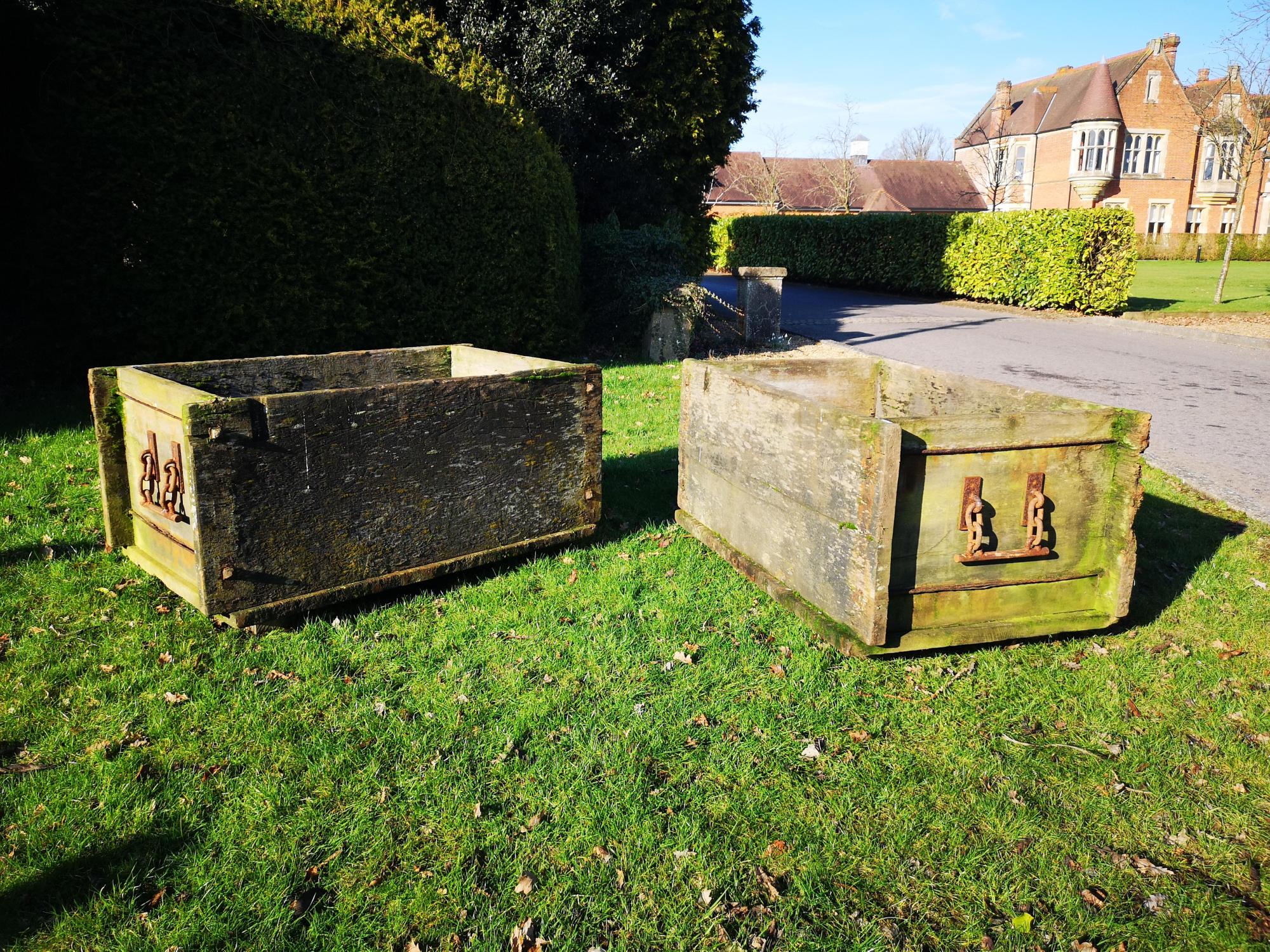 Garden urns/planters: A pair of unusual iron mounted elm rectangular planters, early 20th