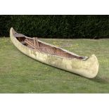 Boat: An early and rare Old Town wood and canvas canoe, circa 1913, with two pairs of paddles and