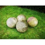 Finials: A set of four carved stone balls, 35cm diameter