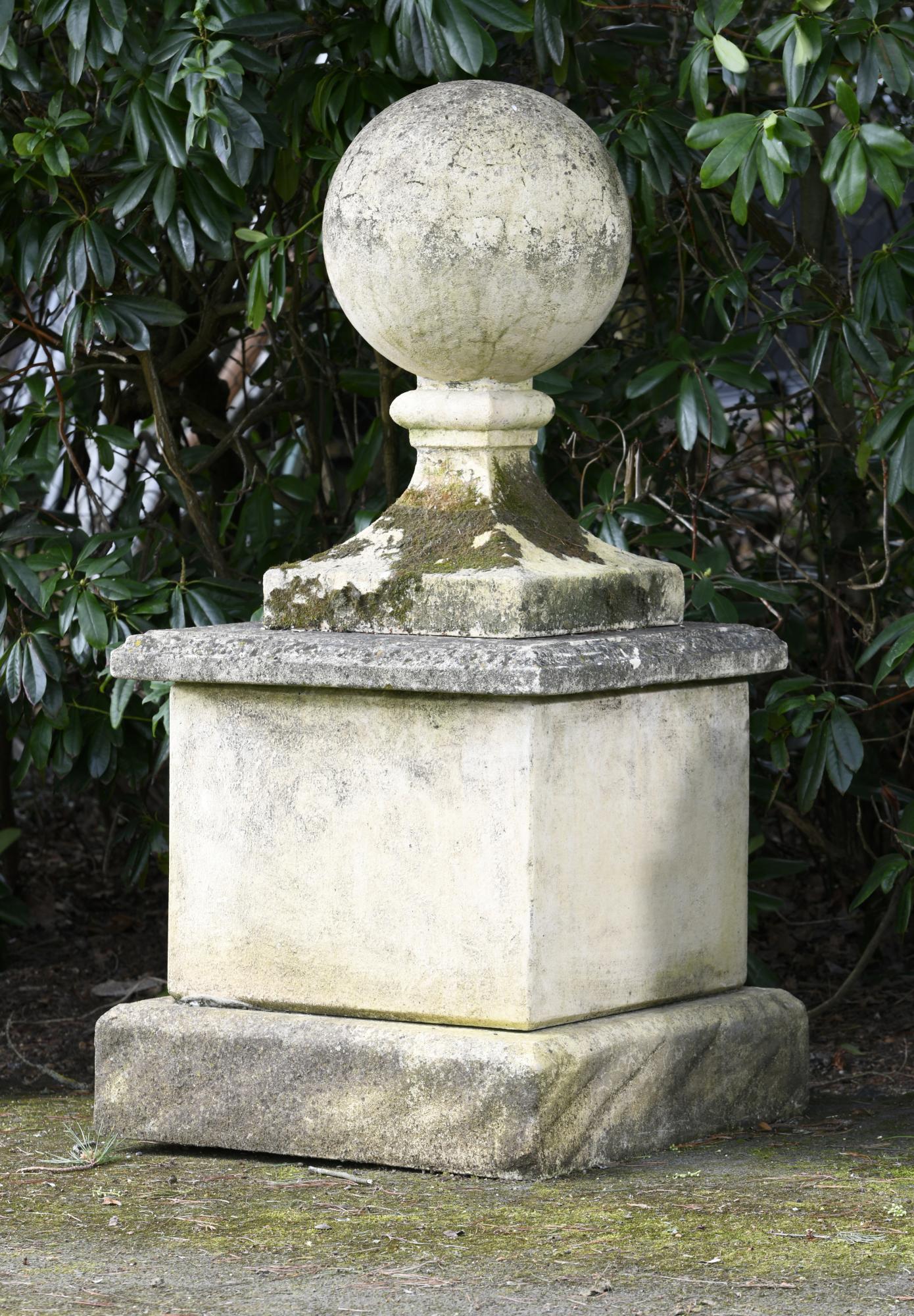 Finials: A composition stone gate pier ball on pedestal, 153cm high