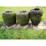 Garden urns/planters: A pair of lava stone pots, 20th century, 54cm high, together with a similar