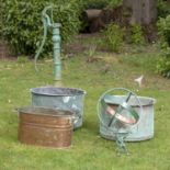 Garden pots/planters: Two riveted washing coppers, 19th century, the larger 63cm diameter, an iron