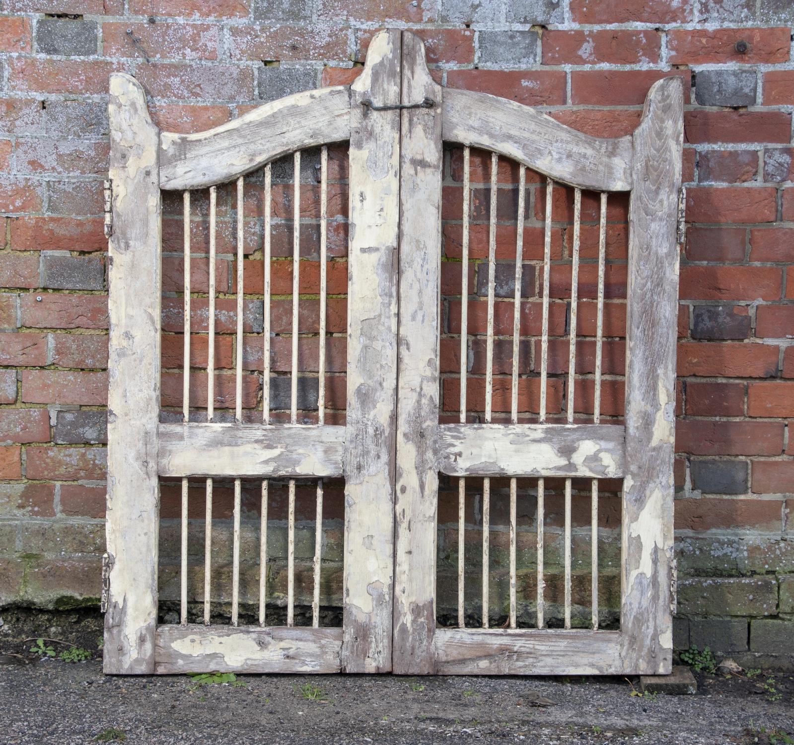 Architectural: A pair of painted wood and iron gates, 20th century, 122cm high by 108cm wide