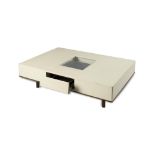 Table/Interior Design: An unusual white leather mounted coffee table, modern, with three drawers one