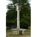 Sundial: A carved limestone pillar sundial with seat, modern, with bronze gnomens, 315cm high by