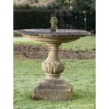 Fountain: A composition stone single tier fountain, modern, 154cm high by 130cm diameter