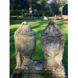 Finials: A pair of carved limestone draped urns, 19th century, 68cm high