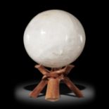 Interior design/minerals: A quartz sphere, Madagascar, on wooden stand, 21cm diameter