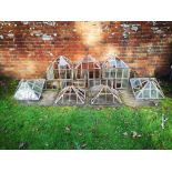 Cold frame: A set of four glazed iron sectional hand lights, each with top, 50cm high by 51cm