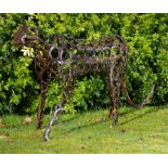 Modern Sculpture: An iron cheetah constructed from simulated horseshoes modern 230cm long by 104cm