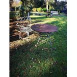 Garden Furniture: A wrought iron seat French, 1st half 20th century 123cm wide, together with a