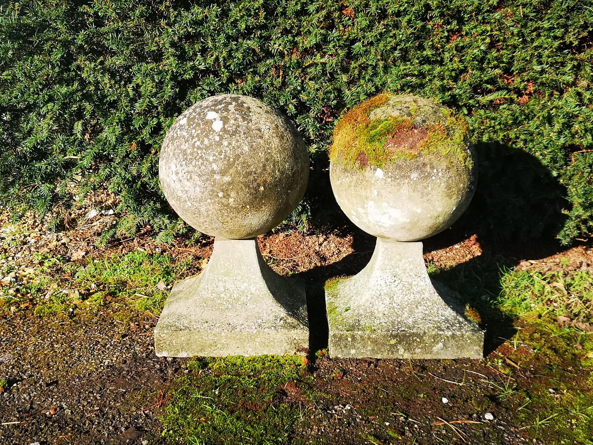 Architectural: A pair of composition stone gate pier balls 2nd half 20th century 57cm high