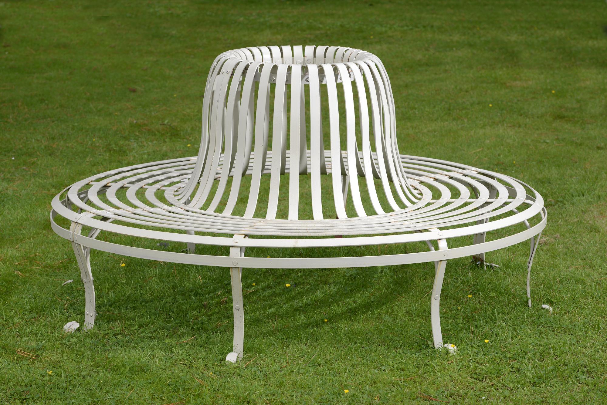 Garden Furniture: A strapwork wrought iron tree seat modern 182cm diameter