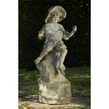 Garden Statuary:A composition stone figure of a fisher boy seated on a rocky outcrop 2nd half 20th