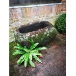 Trough/planter: A near pair of carved lava stone troughs the larger 46cm high by 88cm long, together