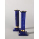 Interior Design/Minerals: A pair of Lapis lazuli veneered brass mounted candlesticks, 18cm high