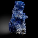 Interior Design/Minerals: A carved Lapis lazuli bear holding a salmon, in fitted box, 17cm high