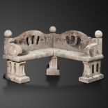 Garden Seats/Furniture: A pair of matching carved Cotswold stone corner seats, early 20th century,