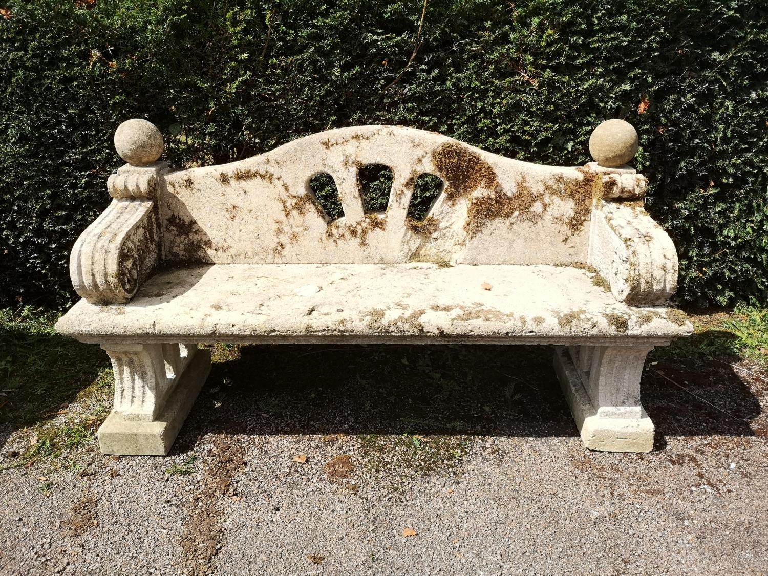 Garden Seats: A near pair of Arts and Craft carved Cotswold stone seats, early 20th century, 176cm