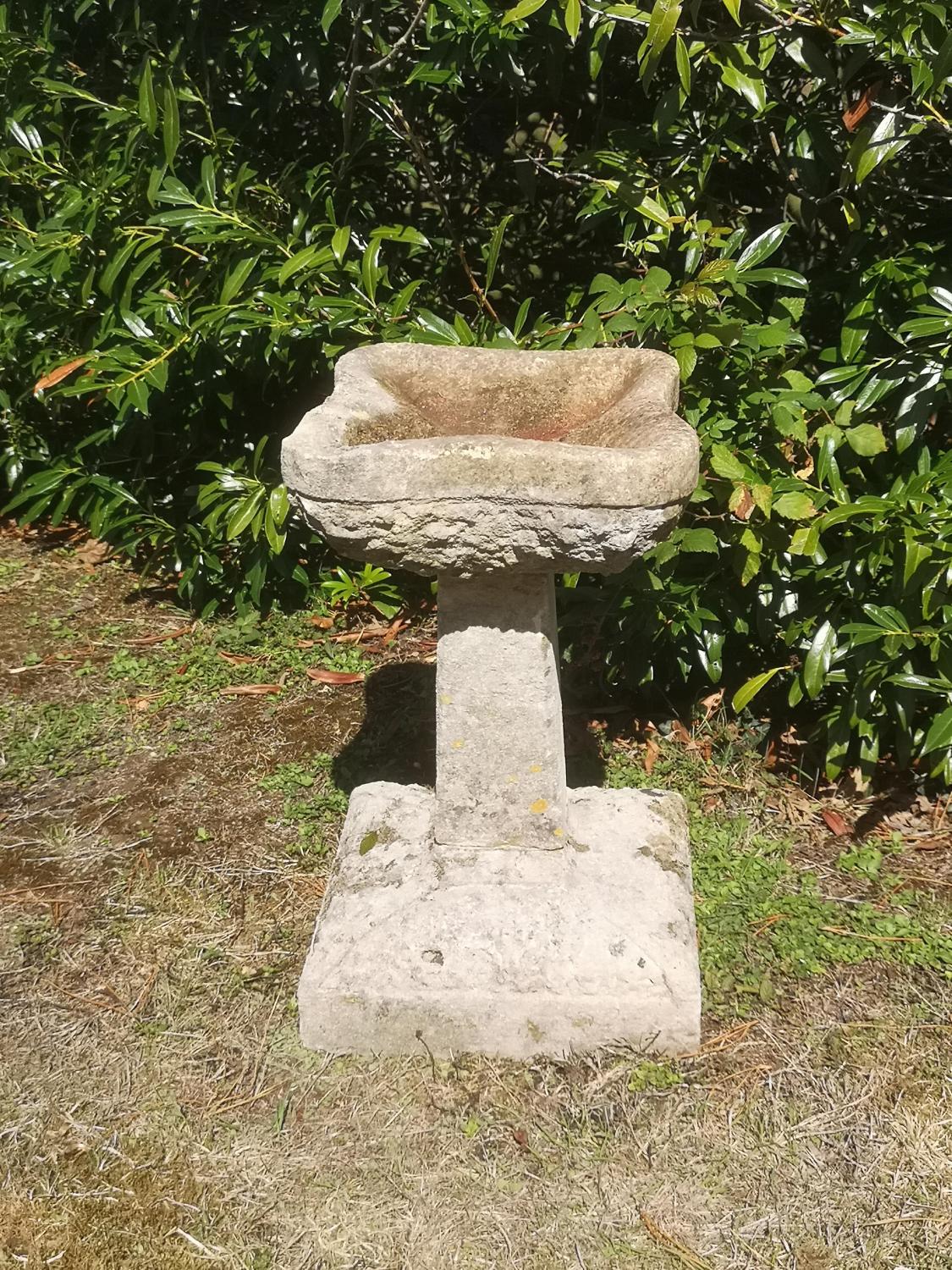 Birdbaths: A carved Cotswold stone Arts and Crafts style birdbath, early 20th century, 54cm