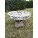 Garden Tables/Furniture: A carved stone table with millstone top on staddlestone base, 107cm