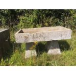 Troughs/Planters: A rectangular carved stone trough on two staddlestone supports, 83cm high by 128cm