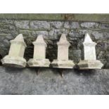 Finials: A set of four composition stone finials, late 19th century, 34cm highThe Cotswold