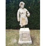 Architectural stone: An early fragmentary carved stone torso of a woman, on Cotswold stone pedestal,