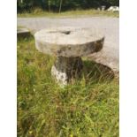 Garden Tables/Furniture: A stone table with a millstone top on staddlestone base, 79cm diameterThe