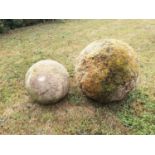 Gate piers: A substantial carved Cotswold stone ball, 52cm diameter, together with a smaller