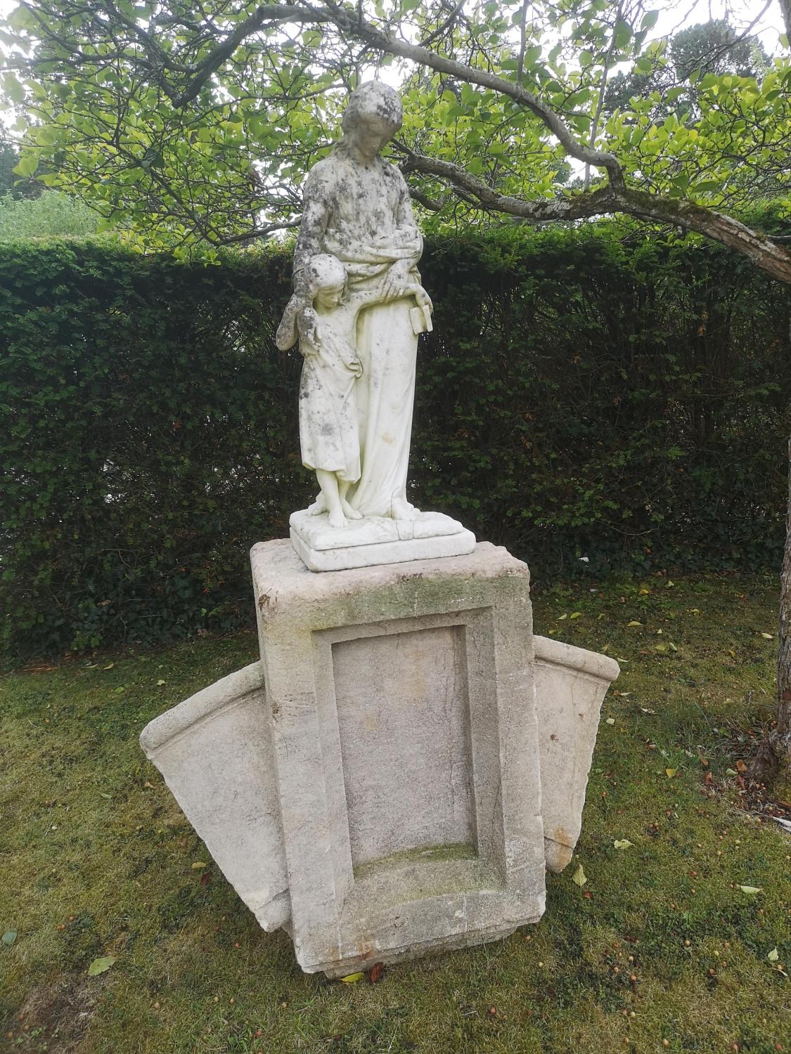 Garden statues: A Victorian carved white marble figure of a mother and child, circa 1870, titled The