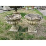 Garden pots/planters: A pair of carved Cotswold stone urns, 19th century, 47cm highThe Cotswold