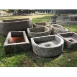 Troughs/Planters: A collection of six troughs, some with drainage holes, the largest 75cm longThe
