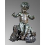 Garden statues: Brenda Putnam: A group of three bronzes, the boy sitting on a rocky outcrop