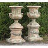 Garden planters/pots: After Girardon: A pair of substantial terracotta urns on pedestals