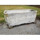 Troughs/Planters: A carved blue stone trough, Low Countries, 18th century, 49cm high by 136cm long