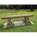 Garden seats: A composition stone bench on reclining lion support, 2nd half 20th century, 166cm