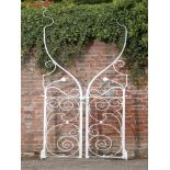 Gates: A pair of unusual wrought iron gates, circa 1900, 294cm high by 112cm wide